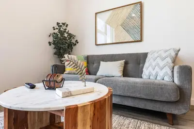 a living room with a couch and a coffee table at The Downtown Haven Suite, 1Mile to Dodger Stadium in Los Angeles