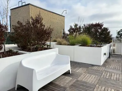 a white bench sitting on top of a building at Melrose Luxe Retreat near The Grove in Los Angeles
