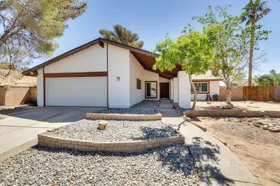 a house with a garage and a driveway at Modern 4-BR near China Lake in Ridgecrest