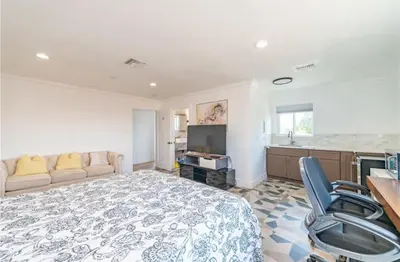 a large bedroom with a bed and a couch at Luxe Stay Room with Private Bathroom 55 in Los Angeles