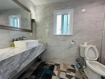 a bathroom with a sink and a toilet and a mirror at Luxe Stay Room with Private Bathroom 55 in Los Angeles