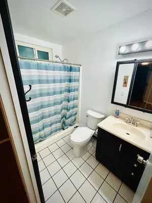 a bathroom with a toilet and a sink and a shower at Western style pool home, 4 bedroom and large yard in Apple Valley
