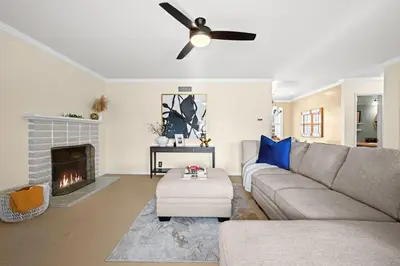 a living room with a couch and a fireplace at The 3BR-2BA Extended Stay Oasis in Anaheim in Anaheim