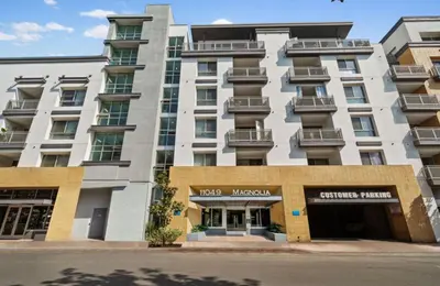a large white building with a store front at Sunset Duo 2 bedroom Charm with FREE Parking in Los Angeles