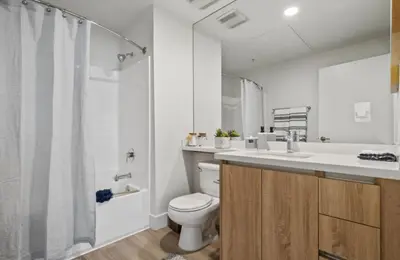a bathroom with a toilet and a sink and a shower at Sunset Duo 2 bedroom Charm with FREE Parking in Los Angeles