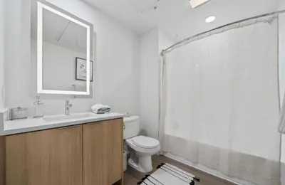 a bathroom with a toilet and a shower curtain at Sunset Duo 2 bedroom Charm with FREE Parking in Los Angeles