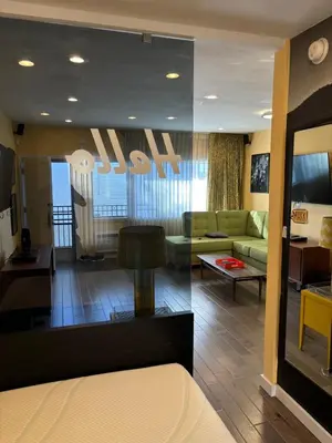 a living room with a couch and a table at west hollywood condo in Los Angeles