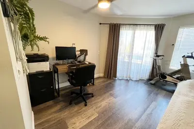 an office with a desk and a computer in a room at Sunny Retro Row Condo- Walk to Beach! in Long Beach