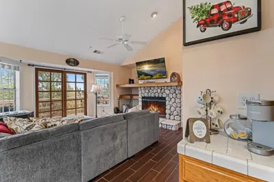 a living room with a couch and a fireplace at Casa de Yukon & Black stone Grill, 3 Level Home in Lake Arrowhead