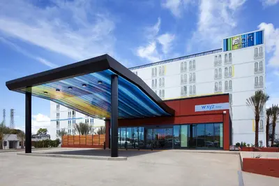 a building with a building with a large building at Aloft El Segundo - Los Angeles Airport in El Segundo