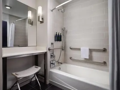 a bathroom with a tub and a sink and a toilet at Aloft El Segundo - Los Angeles Airport in El Segundo