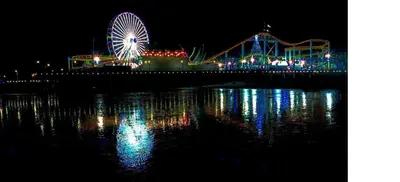 a ferris wheel at a carnival at night at Spinel Stay - Charming 2BR Retreat Zen Garden Views Central in Los Angeles