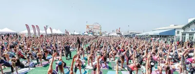 a large crowd of people doing yoga at aestival at Spinel Stay - Charming 2BR Retreat Zen Garden Views Central in Los Angeles