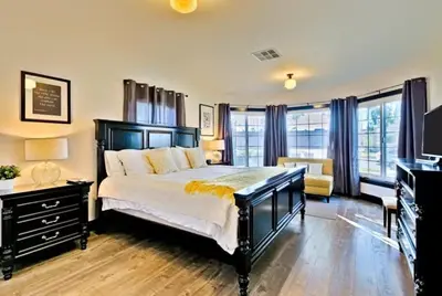 a bedroom with a large bed and a piano at Peaceful Retreat in Anaheim-close to Disney in Anaheim