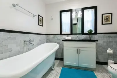 a bathroom with a tub and a sink and a toilet at Peaceful Retreat in Anaheim-close to Disney in Anaheim