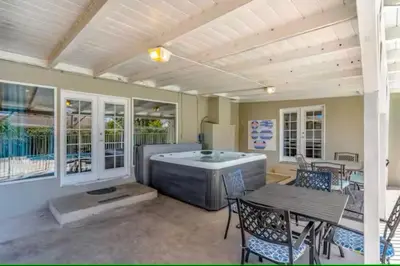 a room with a hot tub and a table and chairs at Anaheim Dream Haven-disneyland Pool Foosball in Anaheim
