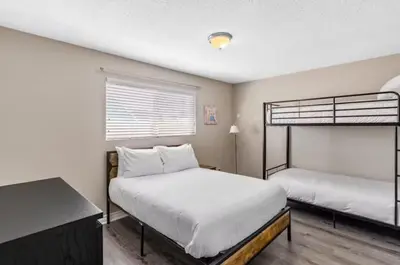 a bedroom with two bunk beds and a window at Anaheim Dream Haven-disneyland Pool Foosball in Anaheim