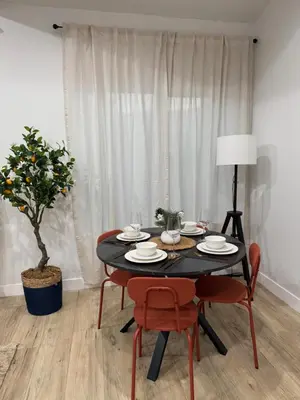 a dining room table with chairs and a plant at Comfy & calm rooms near I-10, Temple city in Temple City
