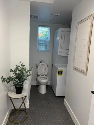a bathroom with a toilet and a plant in it at Comfy & calm rooms near I-10, Temple city in Temple City