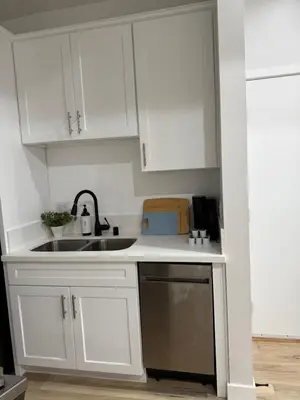 a kitchen with white cabinets and a sink at Comfy & calm rooms near I-10, Temple city in Temple City