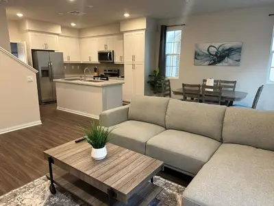a living room with a couch and a table at Gated Upland Home 3b 3 bath in Upland
