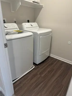 a small laundry room with a washer and dryer at Gated Upland Home 3b 3 bath in Upland