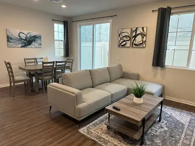 a living room with a couch and a table at Gated Upland Home 3b 3 bath in Upland