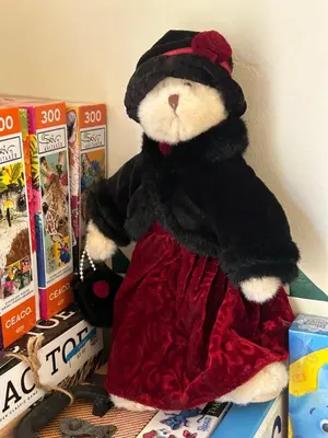 a stuffed teddy bear is sitting on a shelf at UNIQUE SPANISH HACIENDA HOUSE with POOL VINTAGE 1948 EUROPEAN ANTIQUES ETHNIC ART in Bakersfield