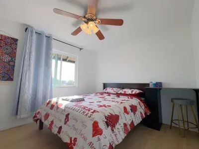 a bedroom with a bed and a ceiling fan at Warm nest Rancho Cucamonga in Rancho Cucamonga