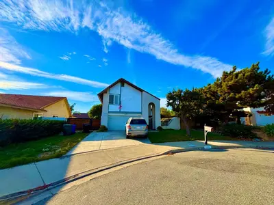 a car parked in the driveway of a house at Warm nest Rancho Cucamonga in Rancho Cucamonga