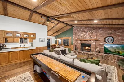 a living room with a couch and a fireplace at Nest and Needles in Big Bear Lake
