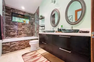 a bathroom with a shower and a toilet and a sink at Cozy Oasis in Oakley with Basketball court pool in Los Angeles