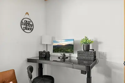 a table with a picture on it in a room at Wild Heart Cabin in Big Bear Lake