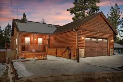 a log cabin with a garage at High Altitude Retreat in Big Bear Lake