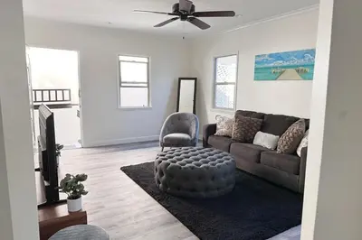 a living room with a couch and a chair at Fully remodeled 1 bedroom in prime West Hollywood in Los Angeles