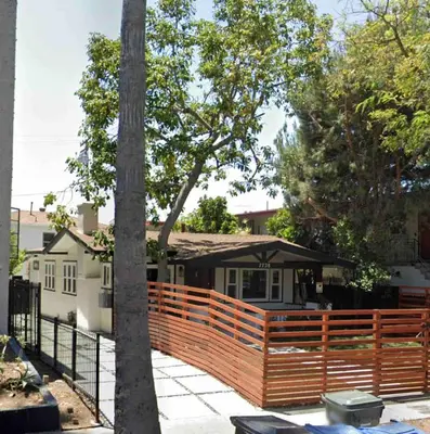 a wooden fence in front of a house at Fully remodeled 1 bedroom in prime West Hollywood in Los Angeles