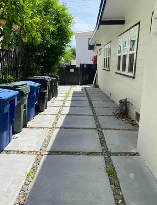 a sidewalk next to a house with trash cans at Fully remodeled 1 bedroom in prime West Hollywood in Los Angeles