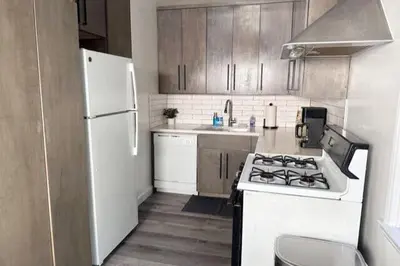 a kitchen with a stove and a white refrigerator at Fully remodeled 1 bedroom in prime West Hollywood in Los Angeles