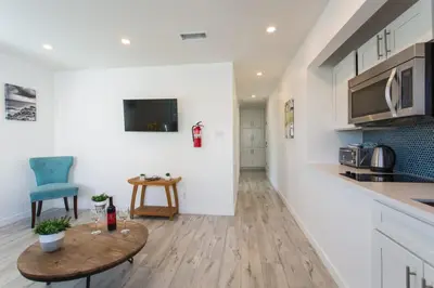a kitchen and living room with a table and a counter at Sunny 1 Bedroom in the Heart of Venice Beach - #4 in Los Angeles