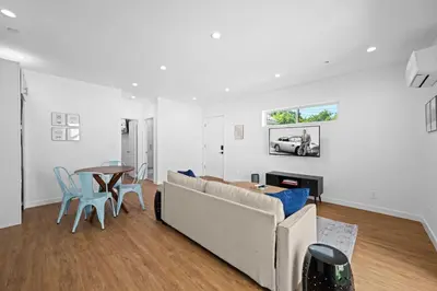 a living room with a couch and a table at Spanish Style Guesthouse Unit 1 in Los Angeles