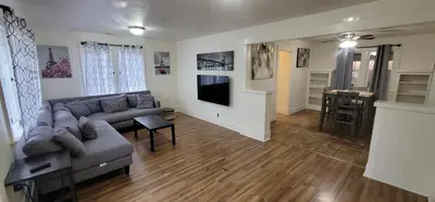 a living room with a couch and a television at Private 3 bedroom Home in Los Angeles - Gardena, California in Gardena
