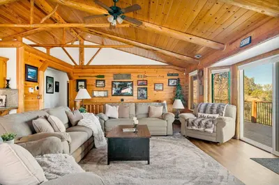 a living room with couches and a ceiling at Its a Wonderful Lodge in Big Bear Lake