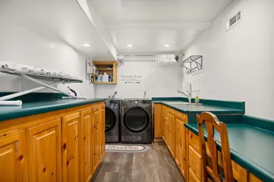 a laundry room with a washer and dryer in it at Its a Wonderful Lodge in Big Bear Lake
