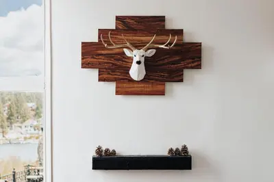 a wall mounted deer head with antlers on a wall at Off The Hook in Big Bear Lake in Big Bear Lake