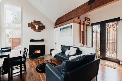 a living room with a couch and a table at Off The Hook in Big Bear Lake in Big Bear Lake