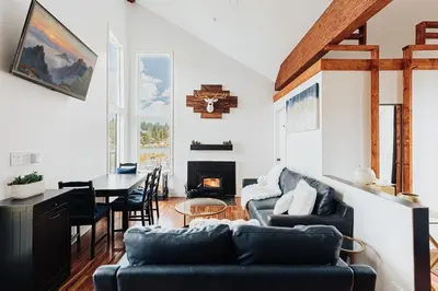 a living room with a couch and a table at Off The Hook in Big Bear Lake in Big Bear Lake