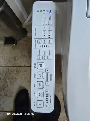 a remote control sitting on the side of a machine at The Ginkgo House in Pasadena