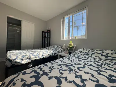 a bedroom with two beds and a window at Blue Private Room near BMO Stadium USC and K-Town in Los Angeles