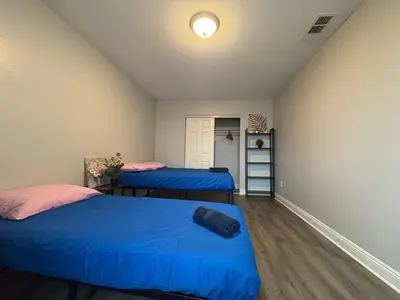 two beds in a room with blue sheets at Blue Stay near BMO Stadium and USC Private Room in Los Angeles