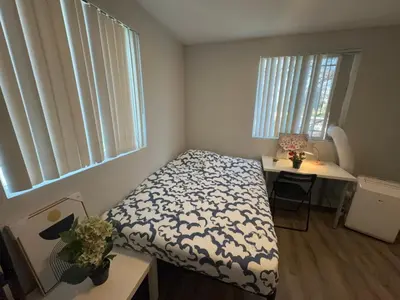 a small bedroom with a bed and a desk at Blue Stay near BMO Stadium and USC Private Room in Los Angeles